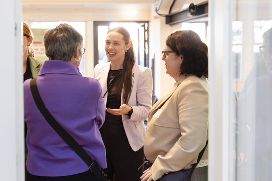 Accessories,  Adult,  Clothing,  Coat,  Conversation,  Female,  Male,  Man,  Person,  Woman