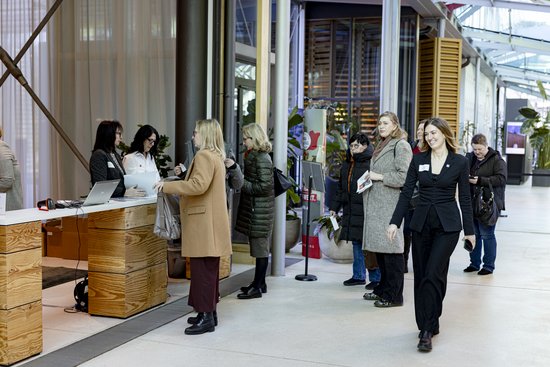 Adult,  Coat,  Female,  Indoors,  Pants,  Person,  Woman