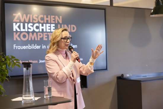 Adult,  Audience,  Crowd,  Electrical Device,  Female,  Microphone,  People,  Person,  Speech,  Woman