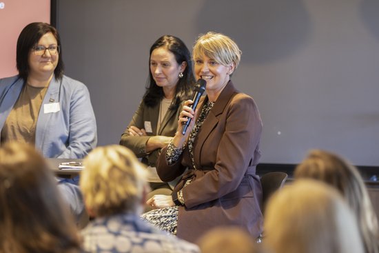 Adult,  Crowd,  Female,  Glasses,  Male,  Man,  Microphone,  People,  Person,  Woman