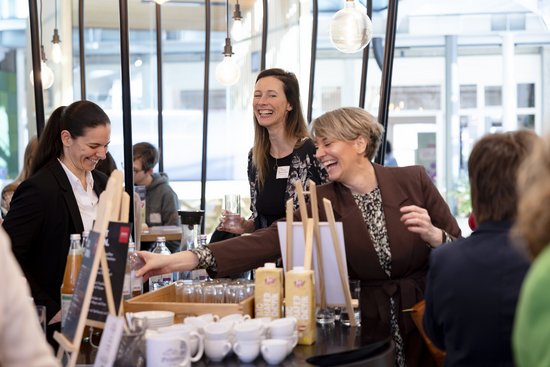 Adult,  Cup,  Female,  Indoors,  Male,  Man,  Necklace,  Person,  Restaurant,  Woman