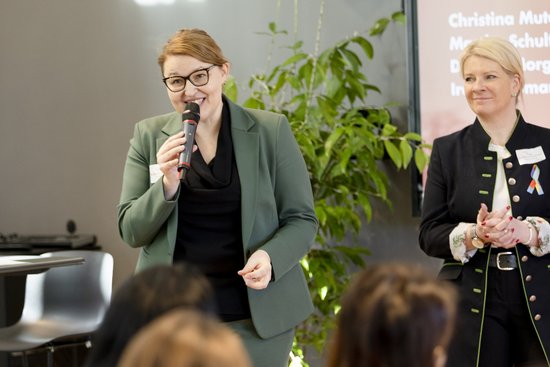 Adult,  Audience,  Crowd,  Electrical Device,  Female,  Microphone,  People,  Person,  Woman,  Wristwatch