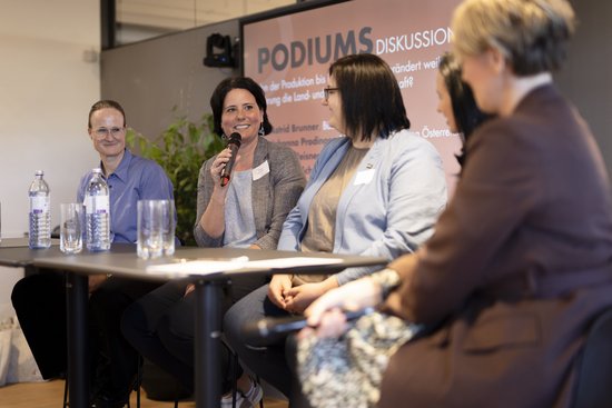 Accessories,  Adult,  Crowd,  Electrical Device,  Female,  Glasses,  Male,  Microphone,  Person,  Woman