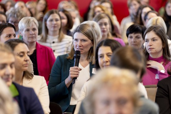 Adult,  Audience,  Crowd,  Electrical Device,  Female,  Microphone,  People,  Person,  Speech,  Woman