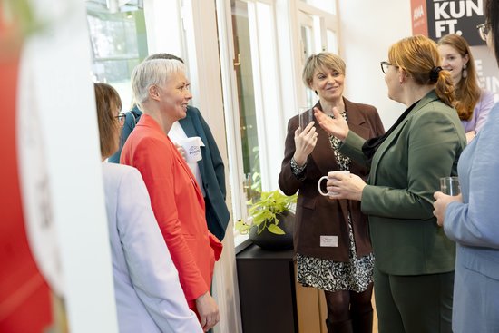 Adult,  Coat,  Cup,  Female,  Glasses,  Male,  Man,  Person,  Woman