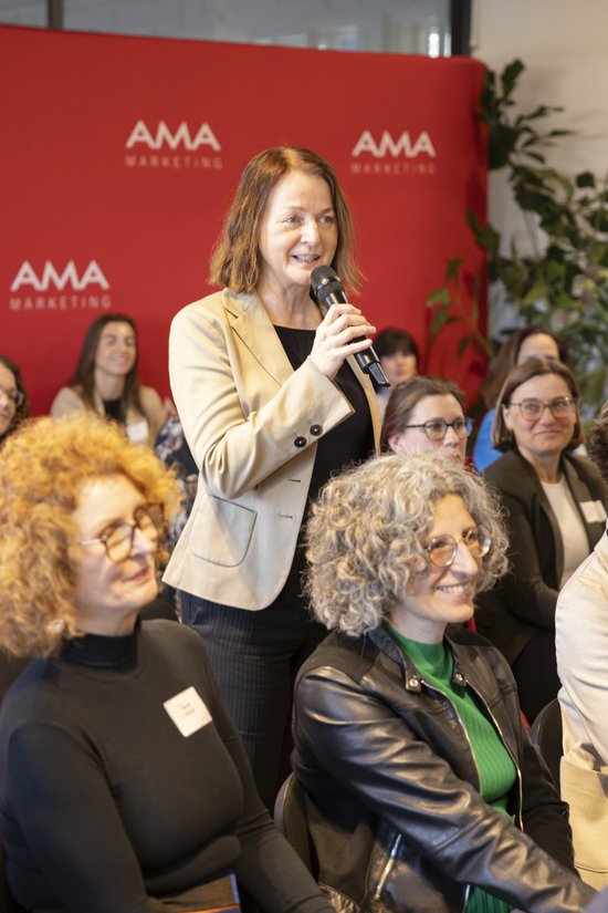 Accessories,  Adult,  Crowd,  Electrical Device,  Female,  Glasses,  Microphone,  People,  Person,  Woman